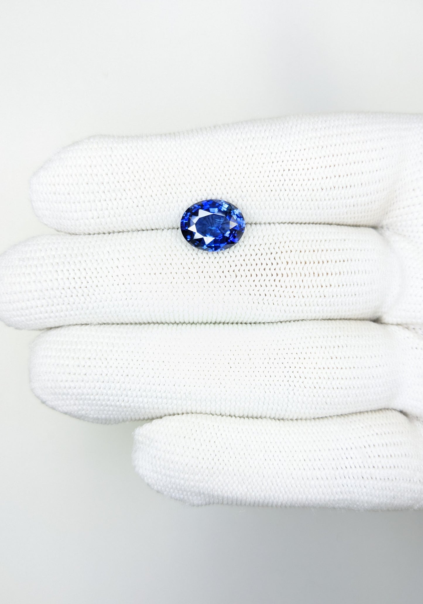 4.20 Carat Oval Cut Heat Blue Sapphire Loose Gemstone on hand