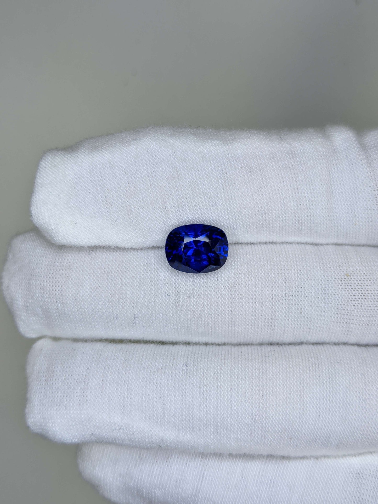 5.07 Carat Cushion Cut Heat Royal Blue Sapphire Loose Gemstone On Hand