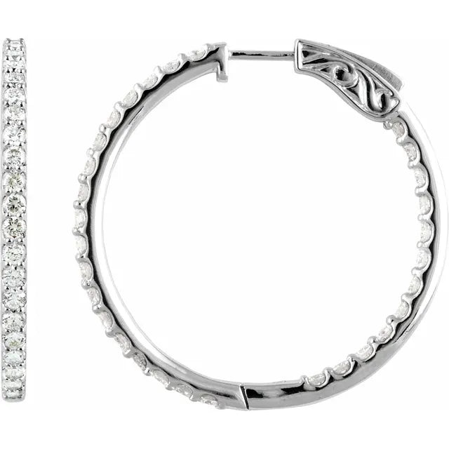 White gold hoop earrings with diamond accents on a white background