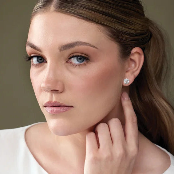 Aralyn 2 Carat and 2.50 Carat Round Cut Diamond Stud Earrings in 14k White Gold On Model