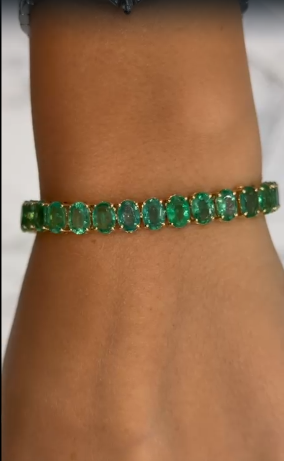Dione 22.90 Carats Oval Cut Zambian Green Emerald Tennis Bracelet in 18k Yellow Gold Vertical View