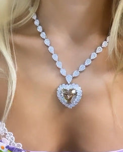 large brown heart shaped diamond necklace on a model
