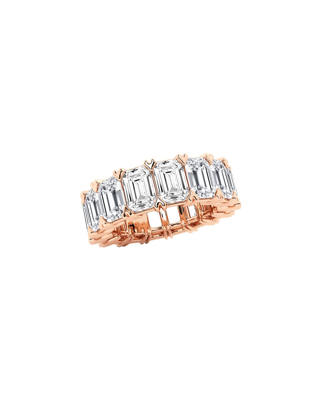 Rose gold ring with emerald-cut diamonds on a white background
