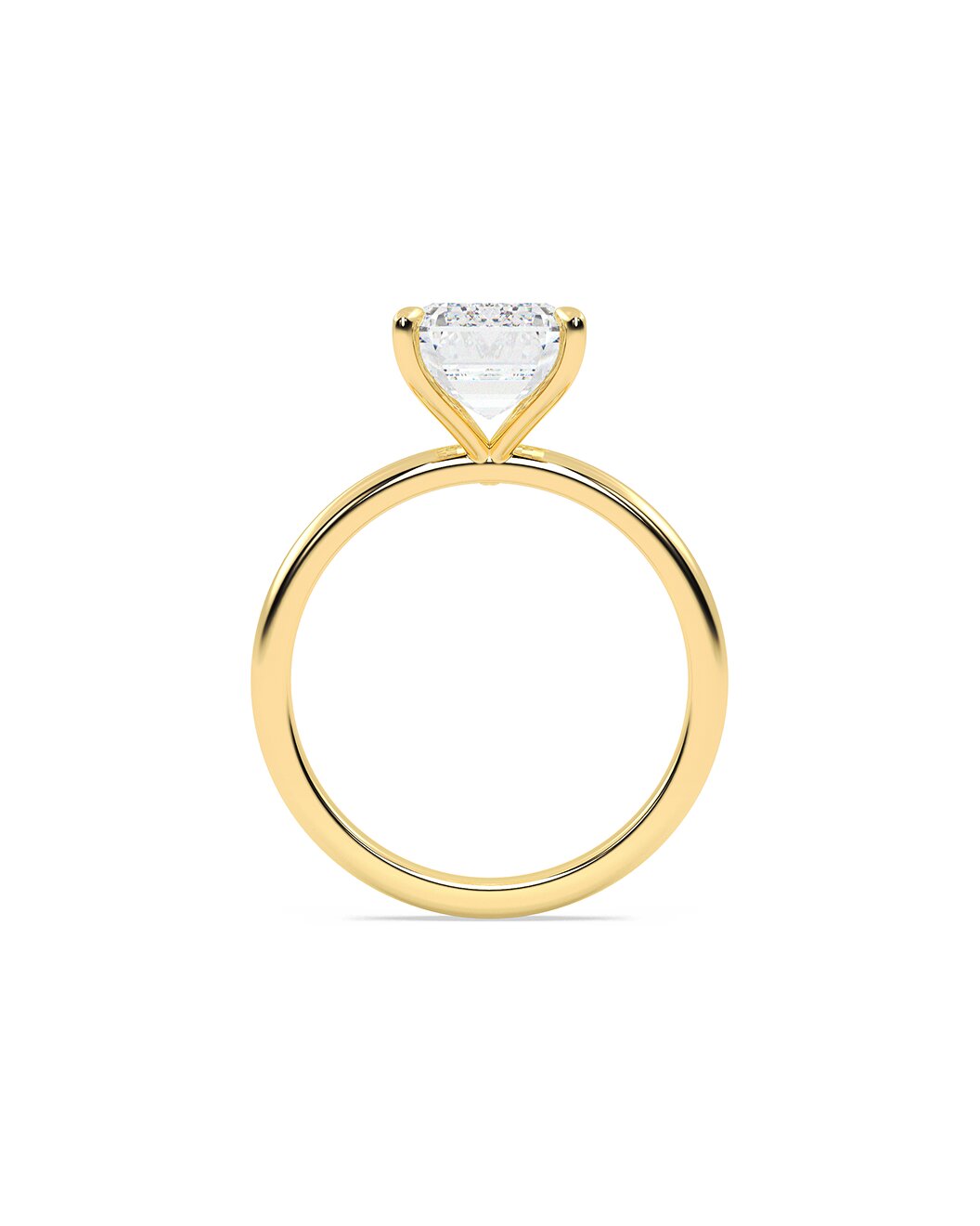 Gold ring with an emerald cut on a white background