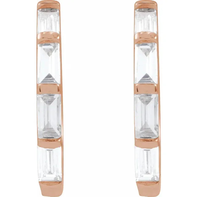 Pair of earrings with rose gold and clear diamonds design on a white background