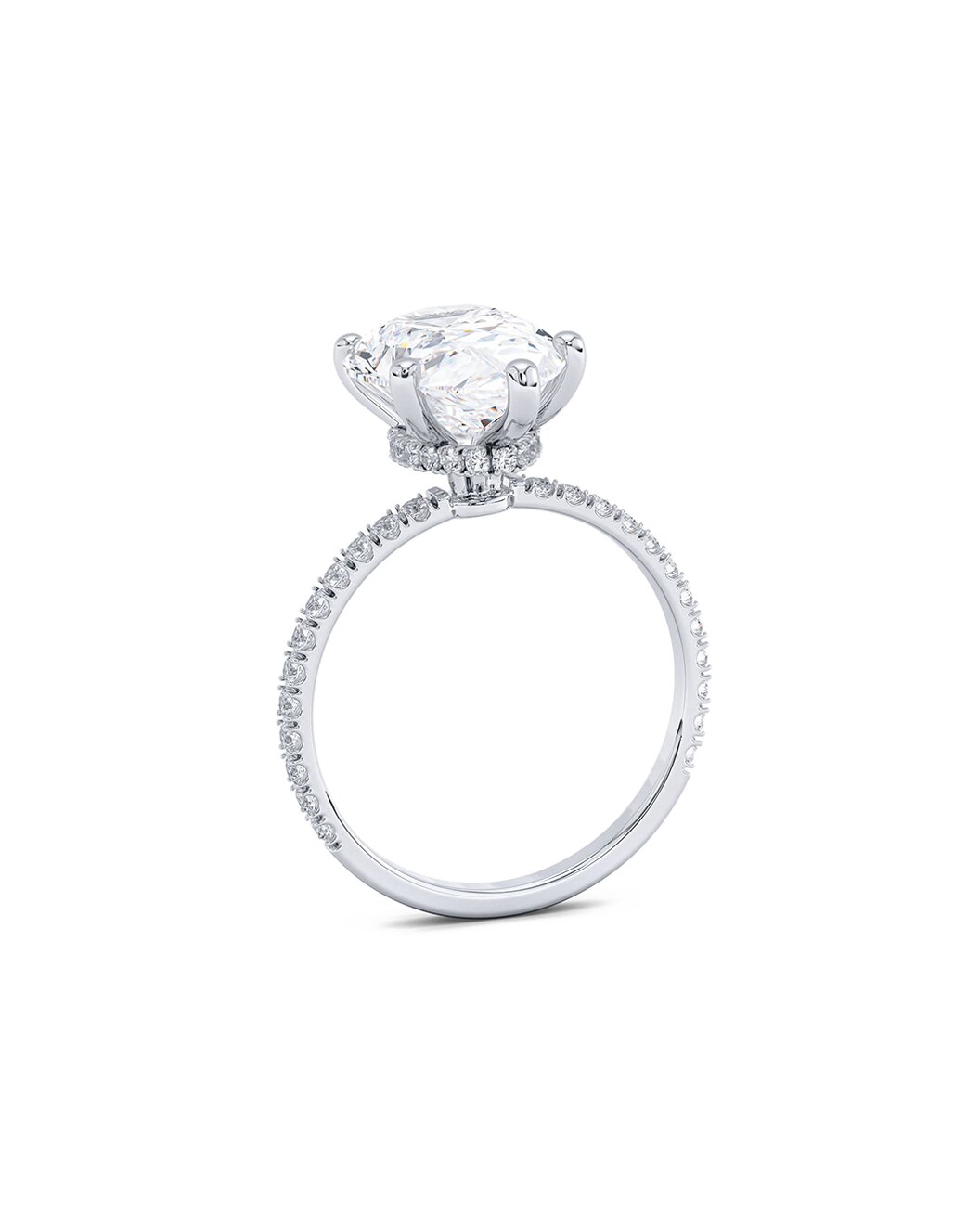 Diamond ring with a pear shape diamond on a white background