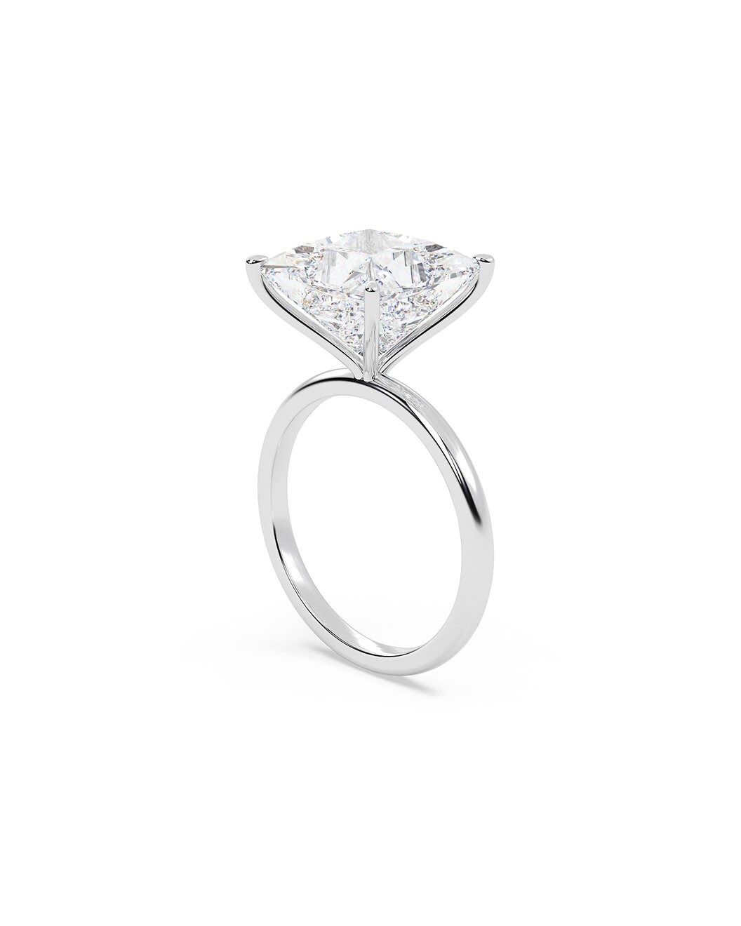 Diamond ring with a princess cut stone on a white background