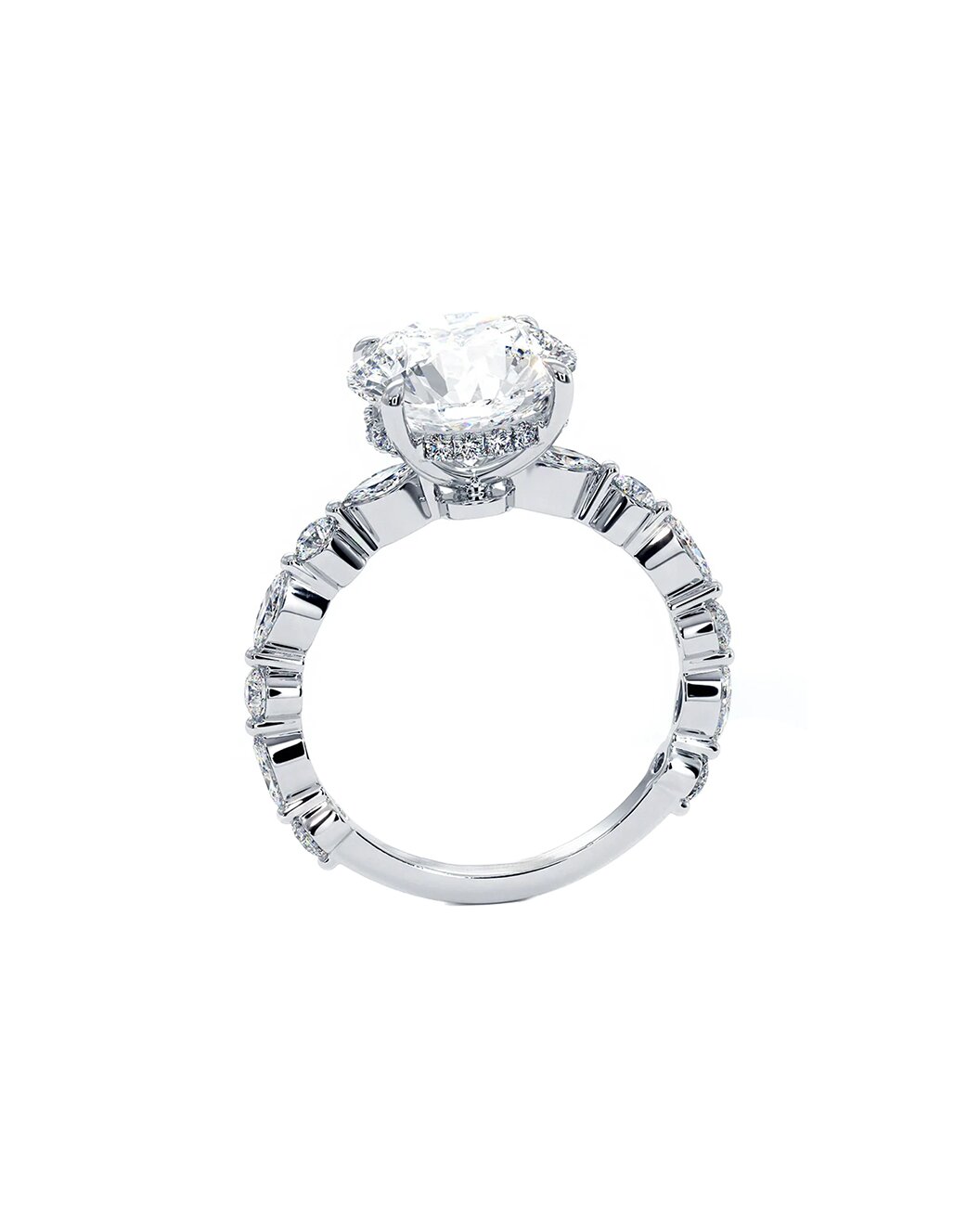 Diamond ring with a round center stone and baguette side stones on a white background