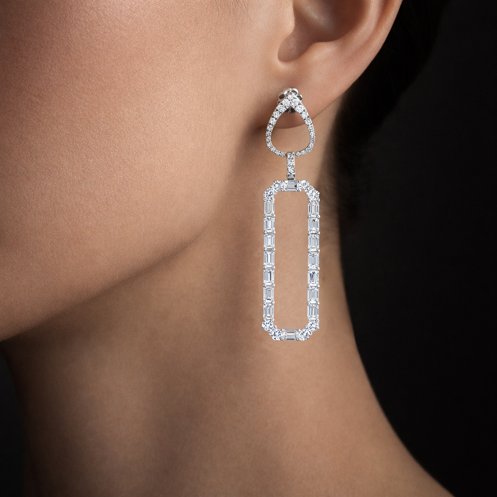 Diamond earring on a model's ear with a dark background