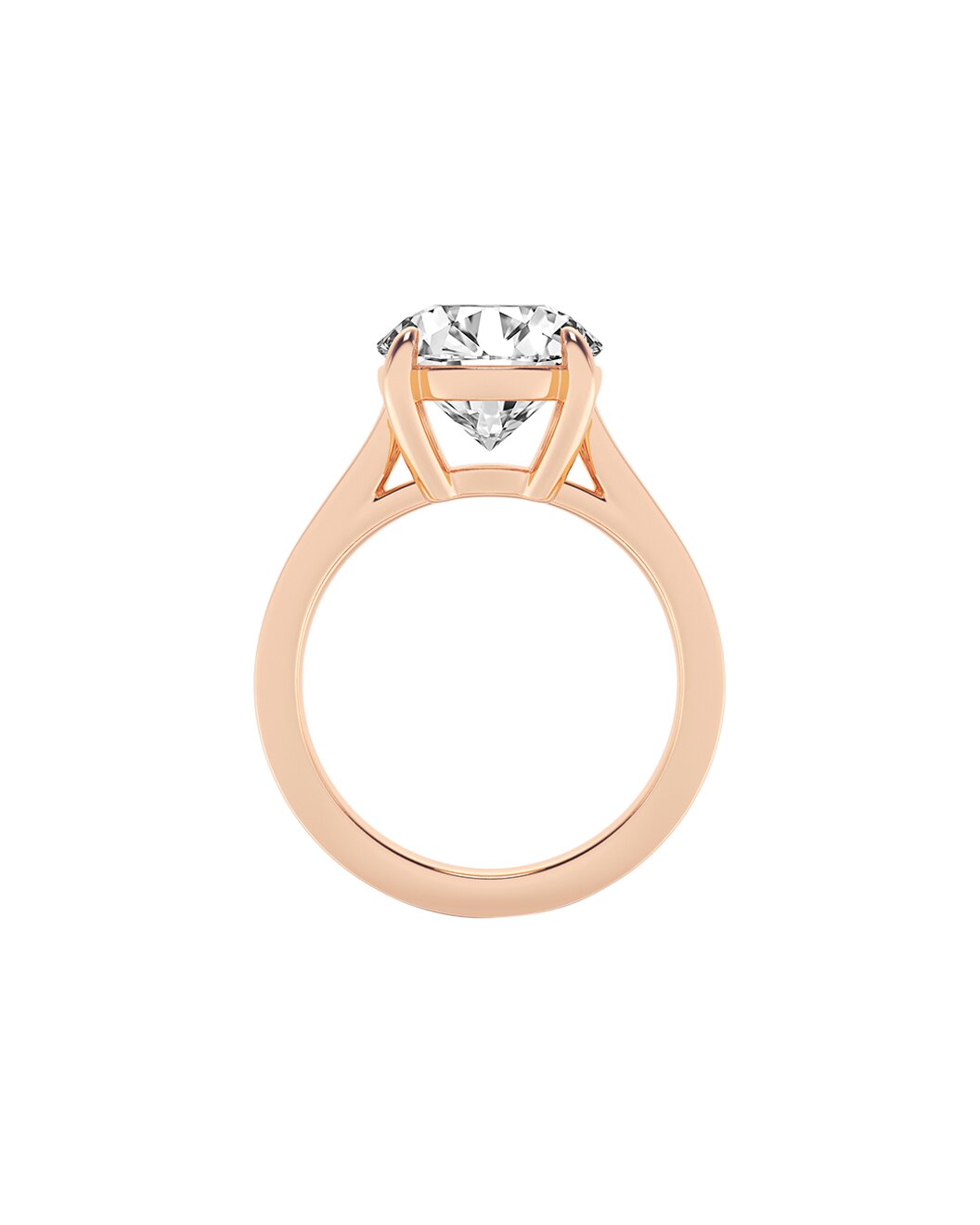 Rose gold ring with a clear gemstone on a white background side
