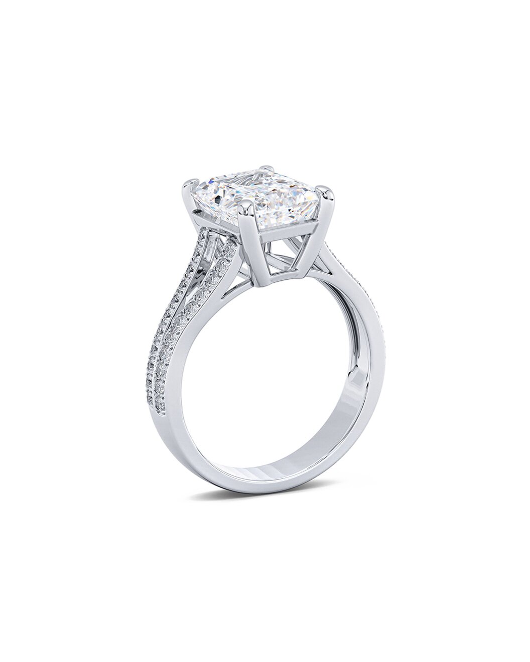 Diamond ring with a central gemstone and smaller stones on a white background