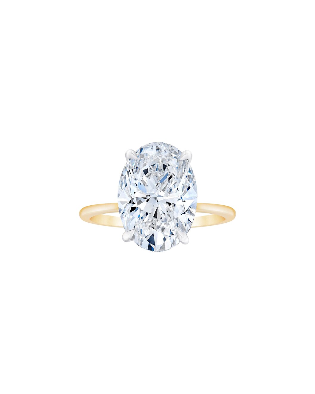 Yellow gold ring with a large diamond on a white background