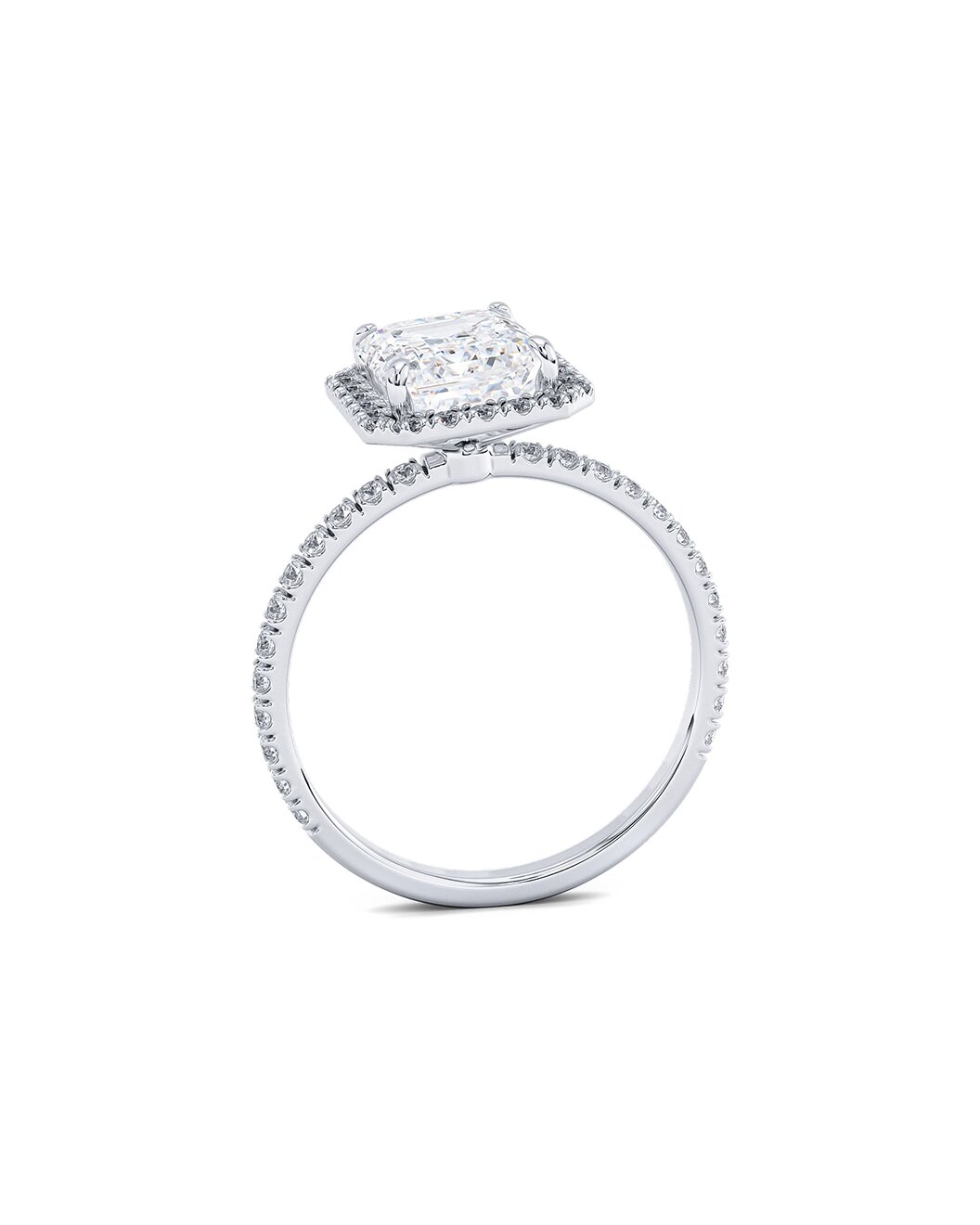 Diamond ring with an emerald-cut center stone on a white background