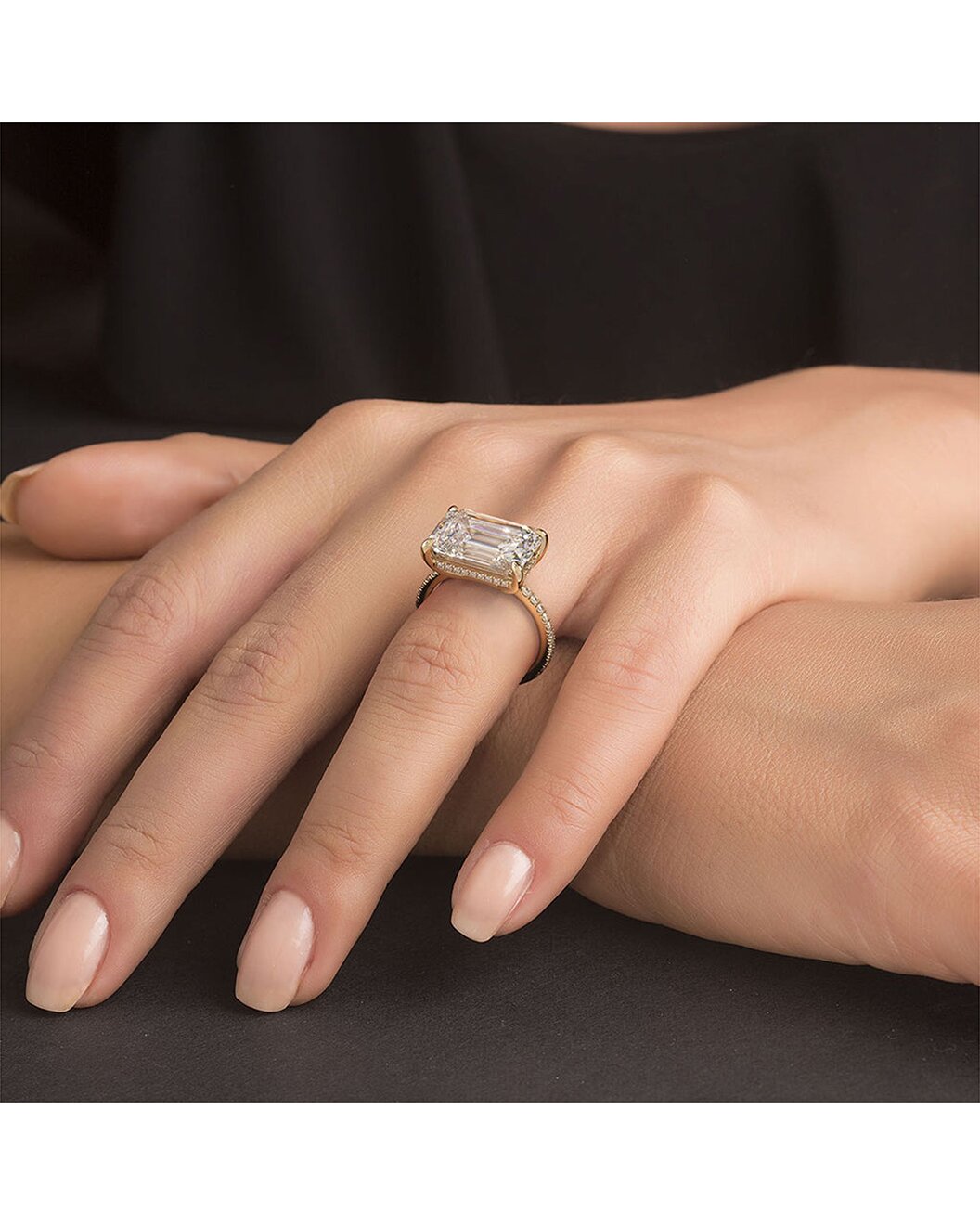 Luthien 5.59 Carat Emerald Cut Lab Grown Diamond Engagement Ring in 14k Yellow Gold On Hand