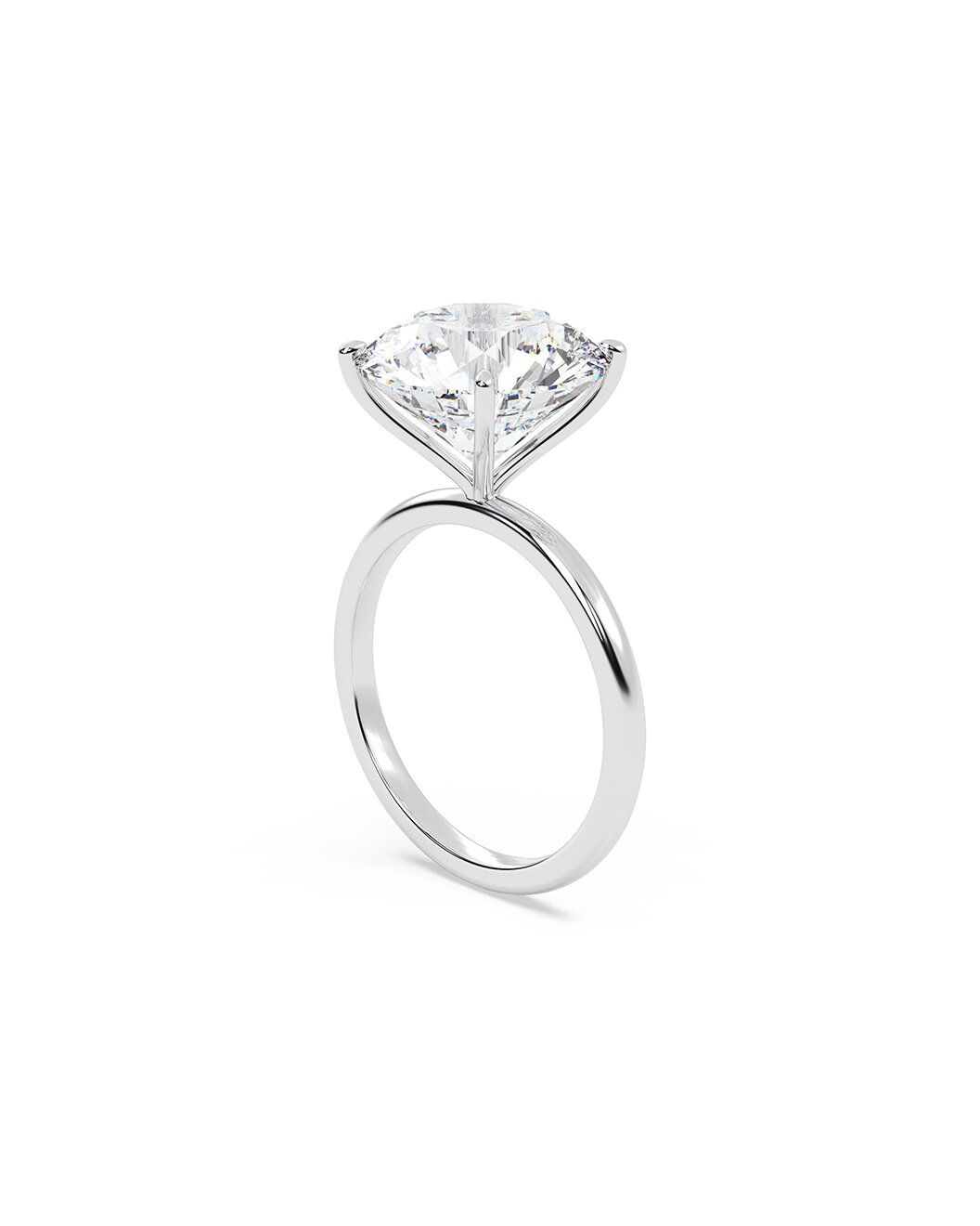 Diamond ring with a round cut diamond on a white background