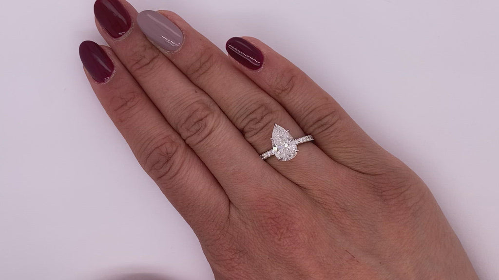 Diamond Ring Pear Shape Cut 3 Carat Sidestone Ring in 18K White Gold Video on Hand