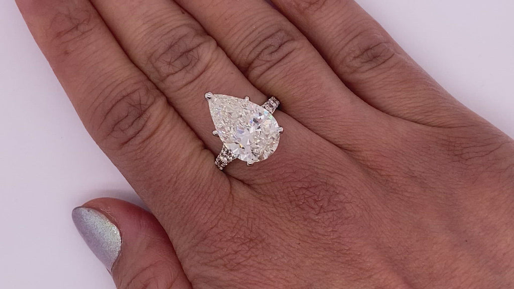 Diamond Ring Pear Shape Cut 8 Carat Sidestone Ring in 18K White Gold Video on Hand