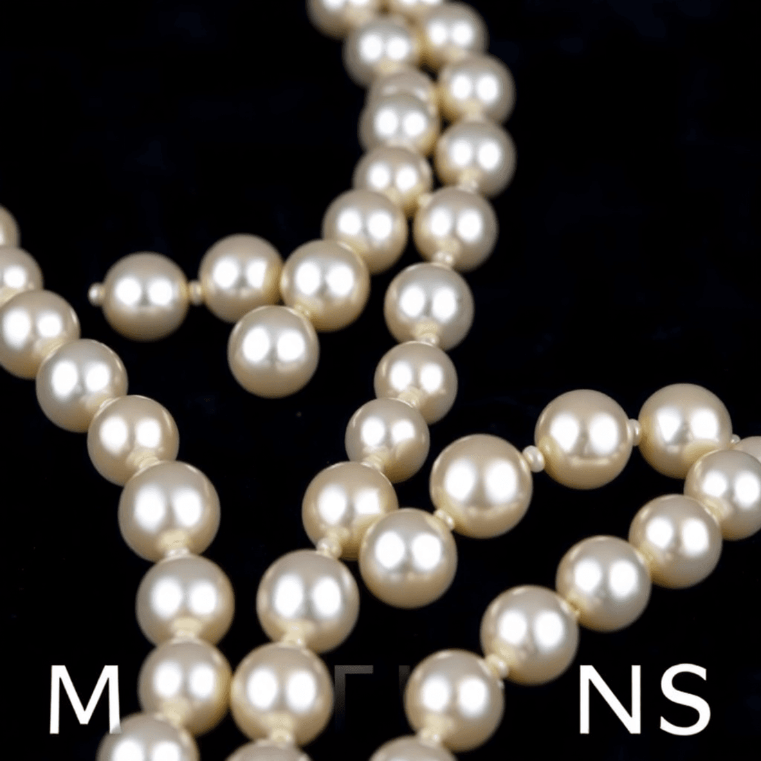 Close-up of a lustrous white pearl necklace elegantly arranged on dark velvet, symbolizing timeless elegance and milestone celebrations.