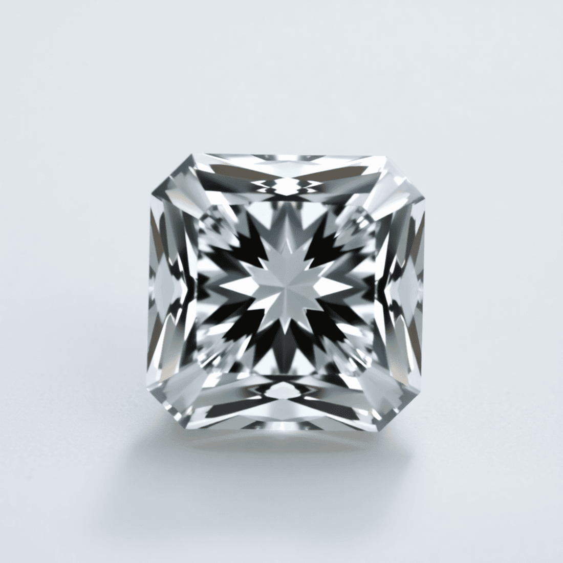 Close-up of a sparkling Asscher cut diamond with step-cut facets, set against a soft neutral background highlighting its brilliance and vintage elegance.