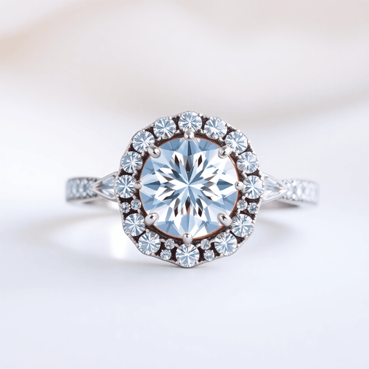 Close-up of a sparkling halo diamond ring with a radiant center stone and smaller diamonds on an elegant, softly lit background.