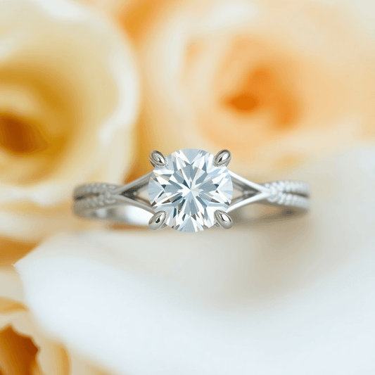 Close-up of a custom engagement ring with a sparkling diamond and elegant setting against a soft, romantic background.