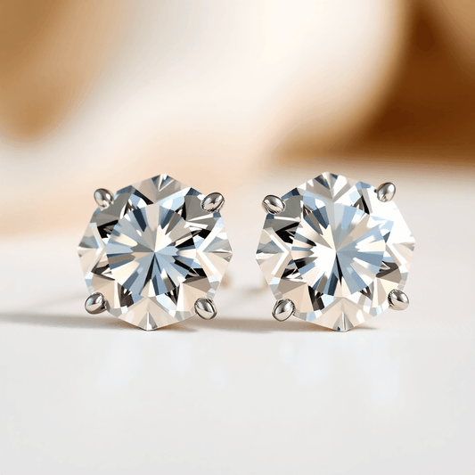 Close-up of sparkling diamond earrings on a soft neutral background with light reflections highlighting their brilliance and clarity.