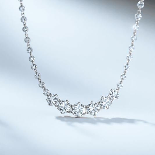 Close-up of a sparkling diamond tennis necklace in a continuous circle with radiant reflections, set against a soft, elegant background.