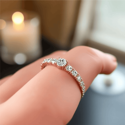 Close-up of a sparkling diamond eternity ring on a finger, glowing softly with light reflections against a blurred elegant background.