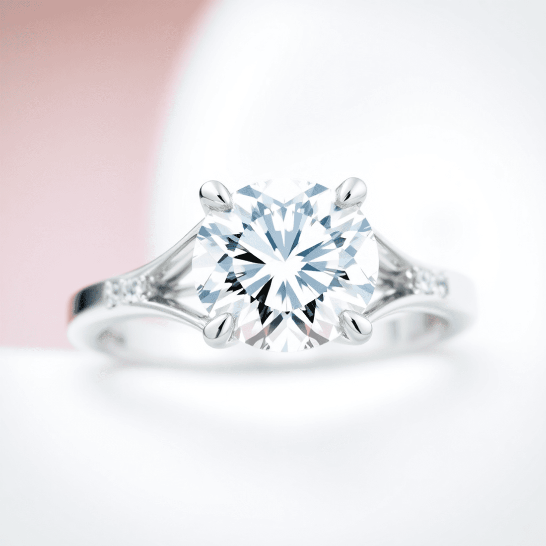 Close-up of an elegant diamond ring with a split shank band, highlighting the open design and sparkling diamond against a soft, blurred background.