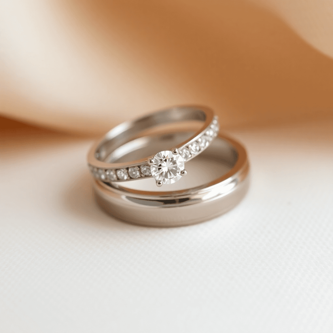 Close-up of elegant lab-grown diamond wedding bands on a soft, neutral background, symbolizing modern and ethical luxury.