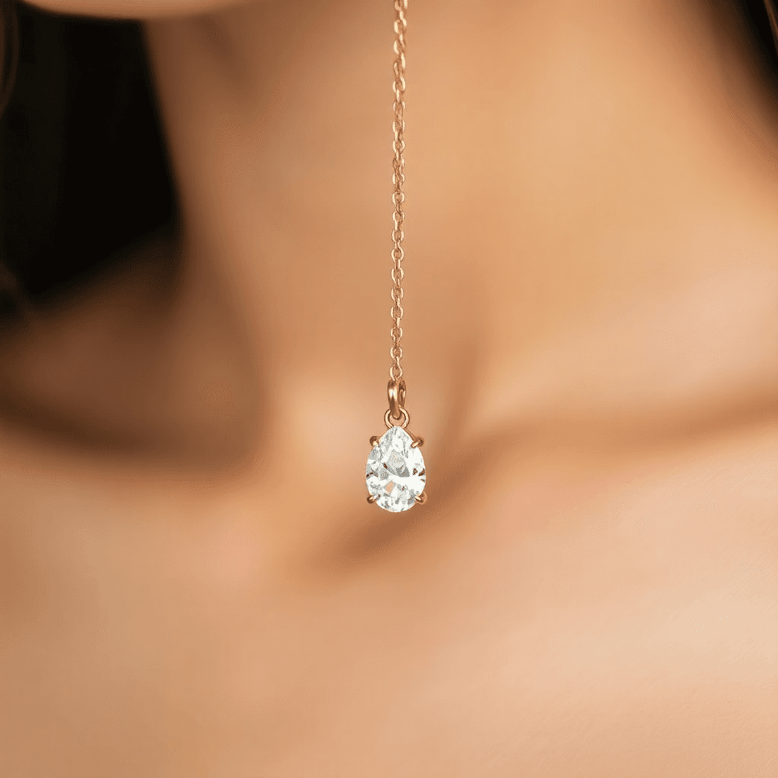 Close-up of a sparkling diamond pendant on a delicate gold chain draped gracefully around a slender neck against a soft, blurred background.