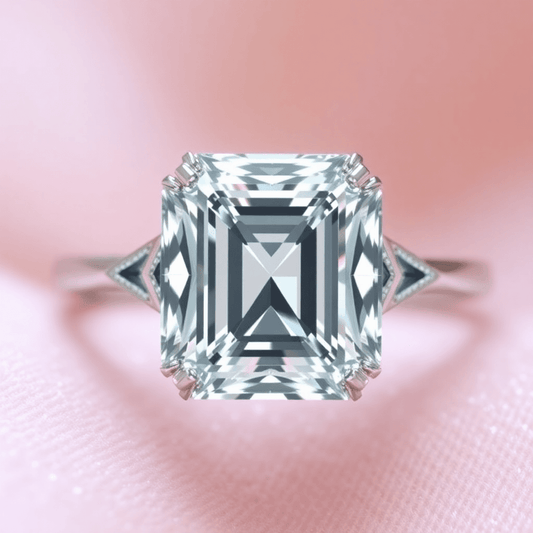Close-up of a sparkling Asscher cut diamond engagement ring in a vintage 1920s Art Deco setting on a soft, luxurious background.