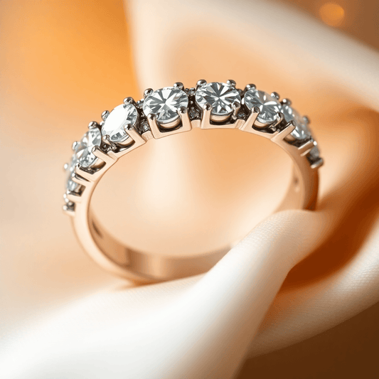 Close-up of a sparkling diamond eternity band on soft fabric, glowing warmly to highlight the brilliance and facets of the diamonds.
