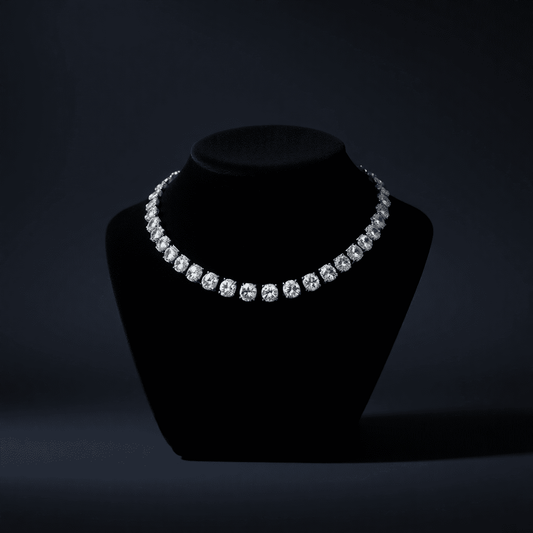 Sparkling diamond tennis necklace on black velvet display, glowing softly against a dark background highlighting its brilliance and elegance.