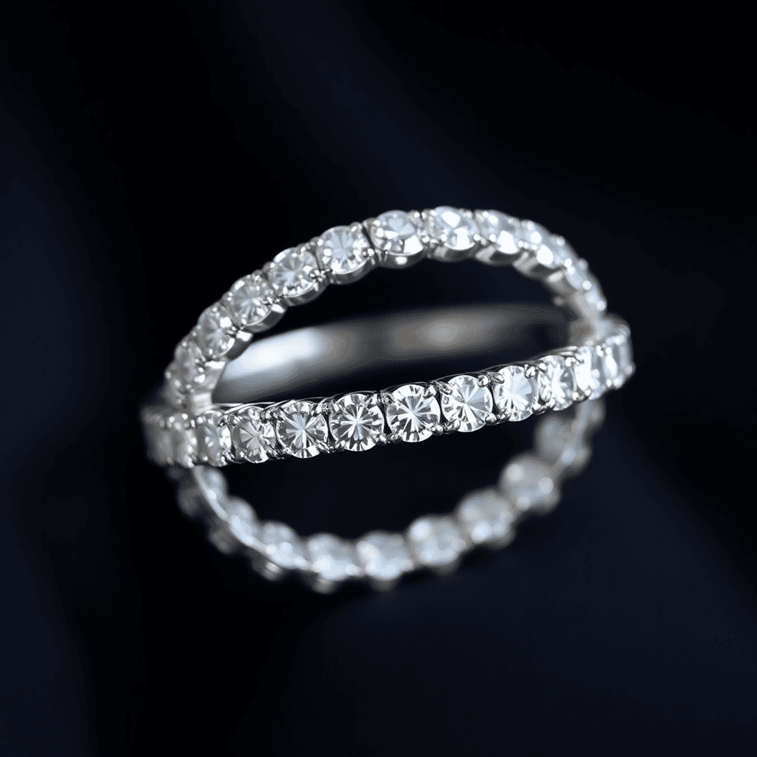 Close-up of a sparkling lab-grown diamond eternity ring with a continuous circle of diamonds on a sleek band, glowing softly against a dark background.