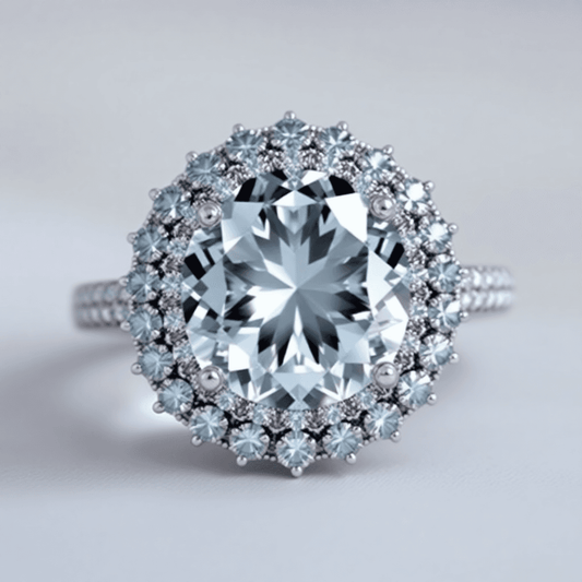 Close-up of a sparkling halo ring with a large central gemstone surrounded by smaller diamonds, set against a soft background with subtle light reflections.