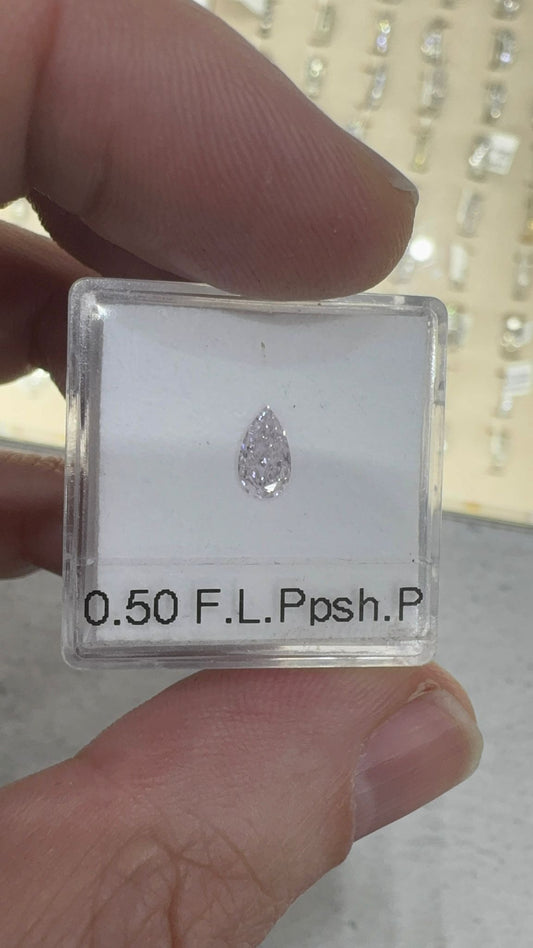 Diamond in a clear box held by a hand
