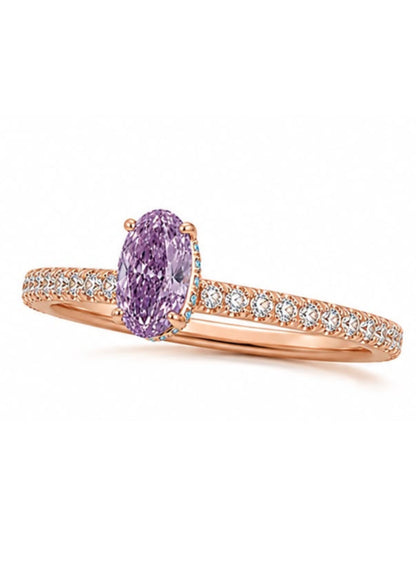 Angled view of a rose gold hidden halo engagement ring featuring a natural Fancy Intense Pink Purple oval diamond.