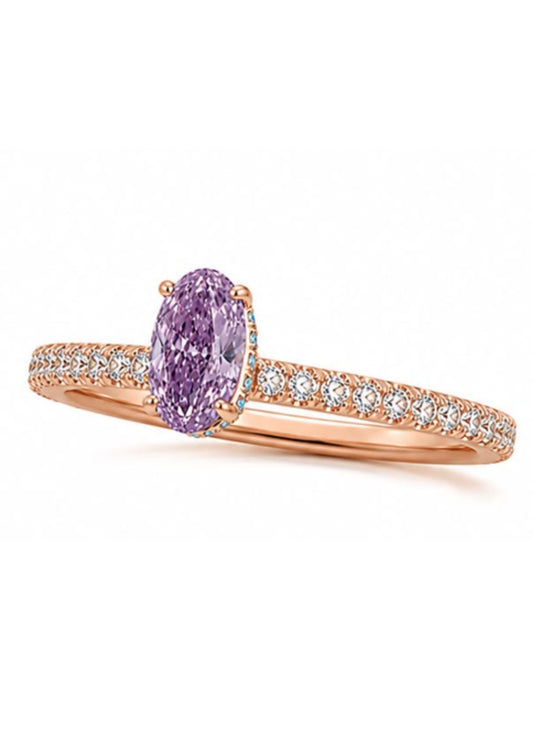 Angled view of a rose gold hidden halo engagement ring featuring a natural Fancy Intense Pink Purple oval diamond.