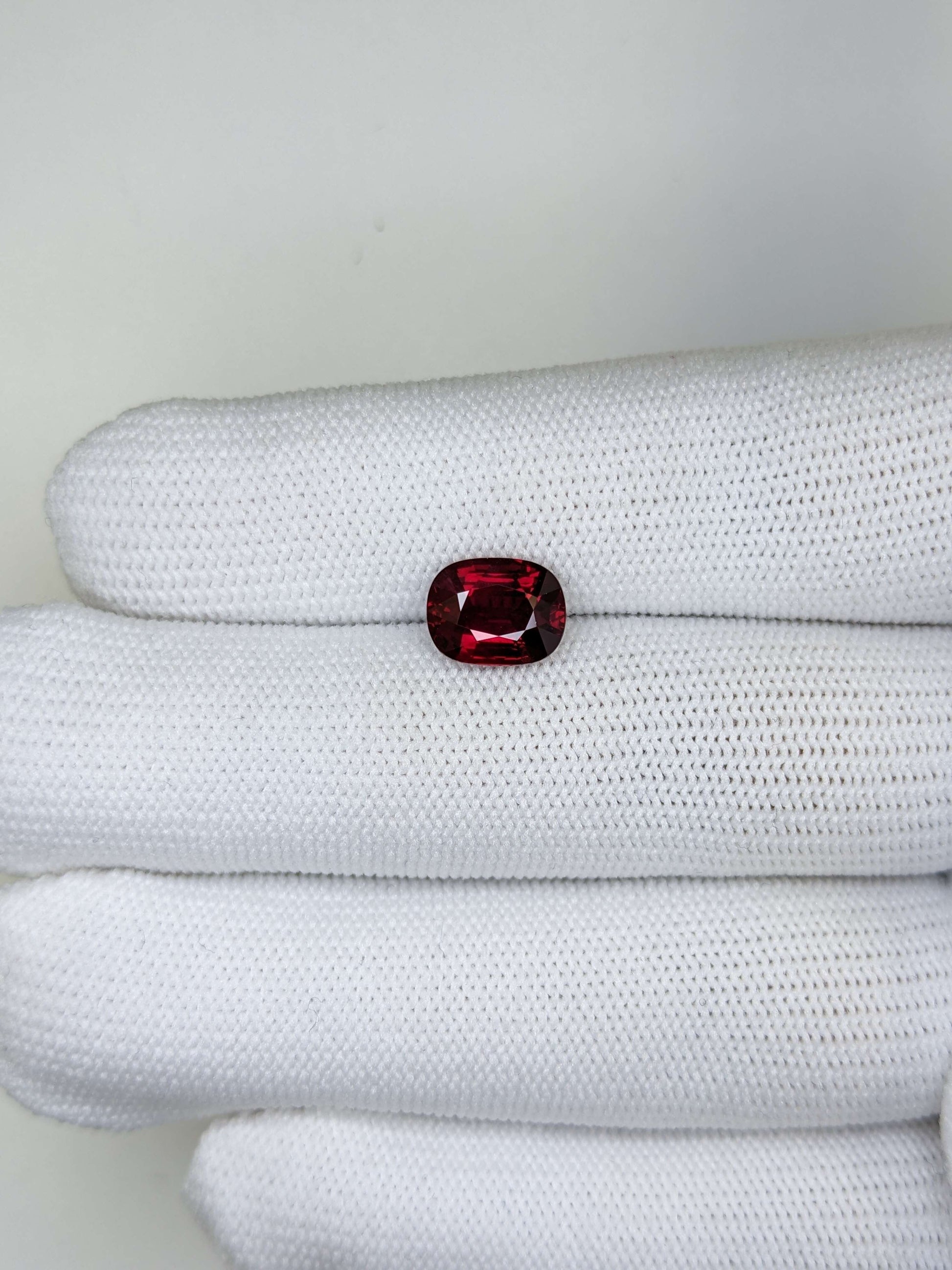 Red ruby gemstone on a white background