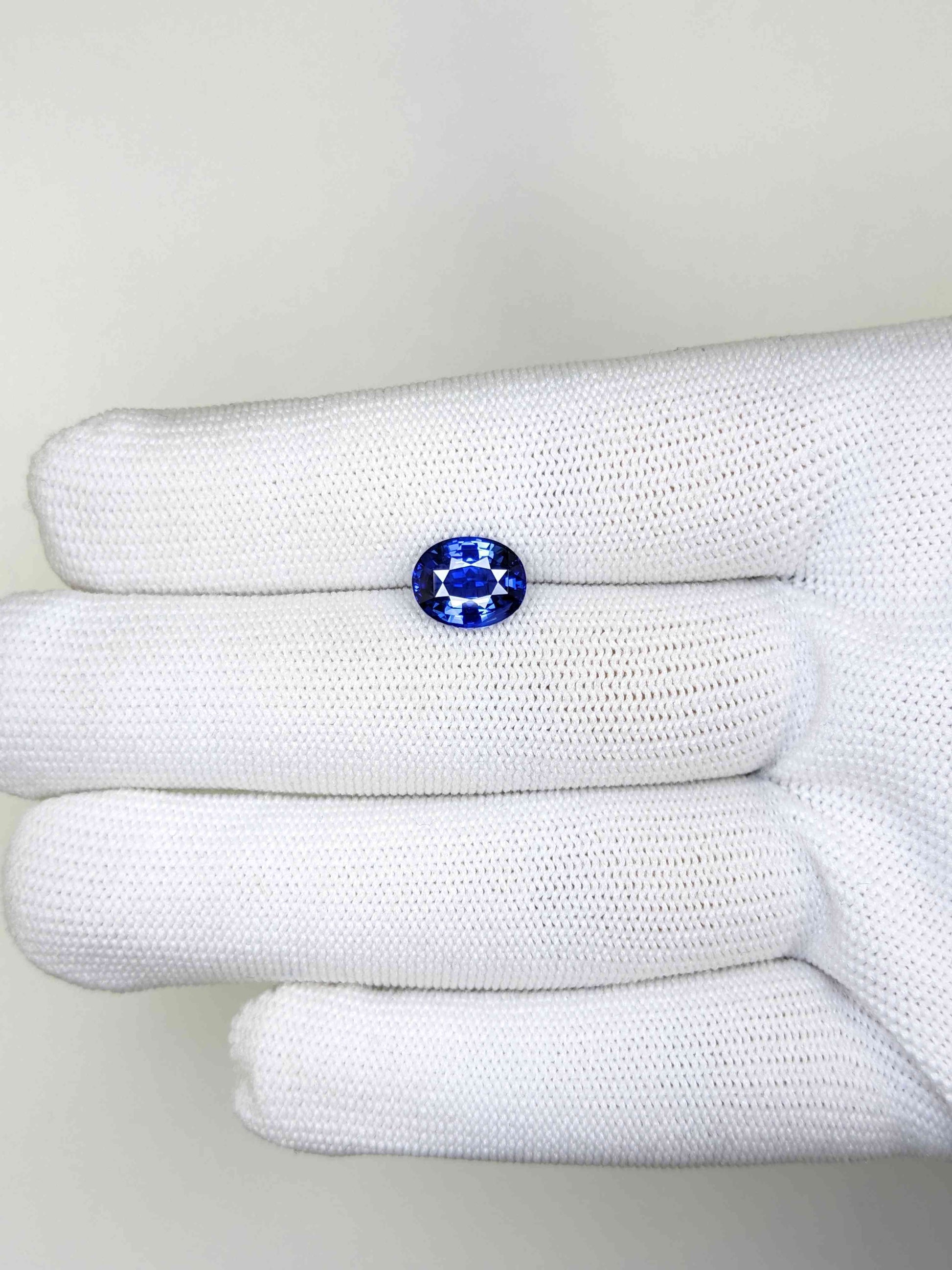 3.02 Carat Oval Cut Heat Blue Sapphire Loose Gemstone on hand