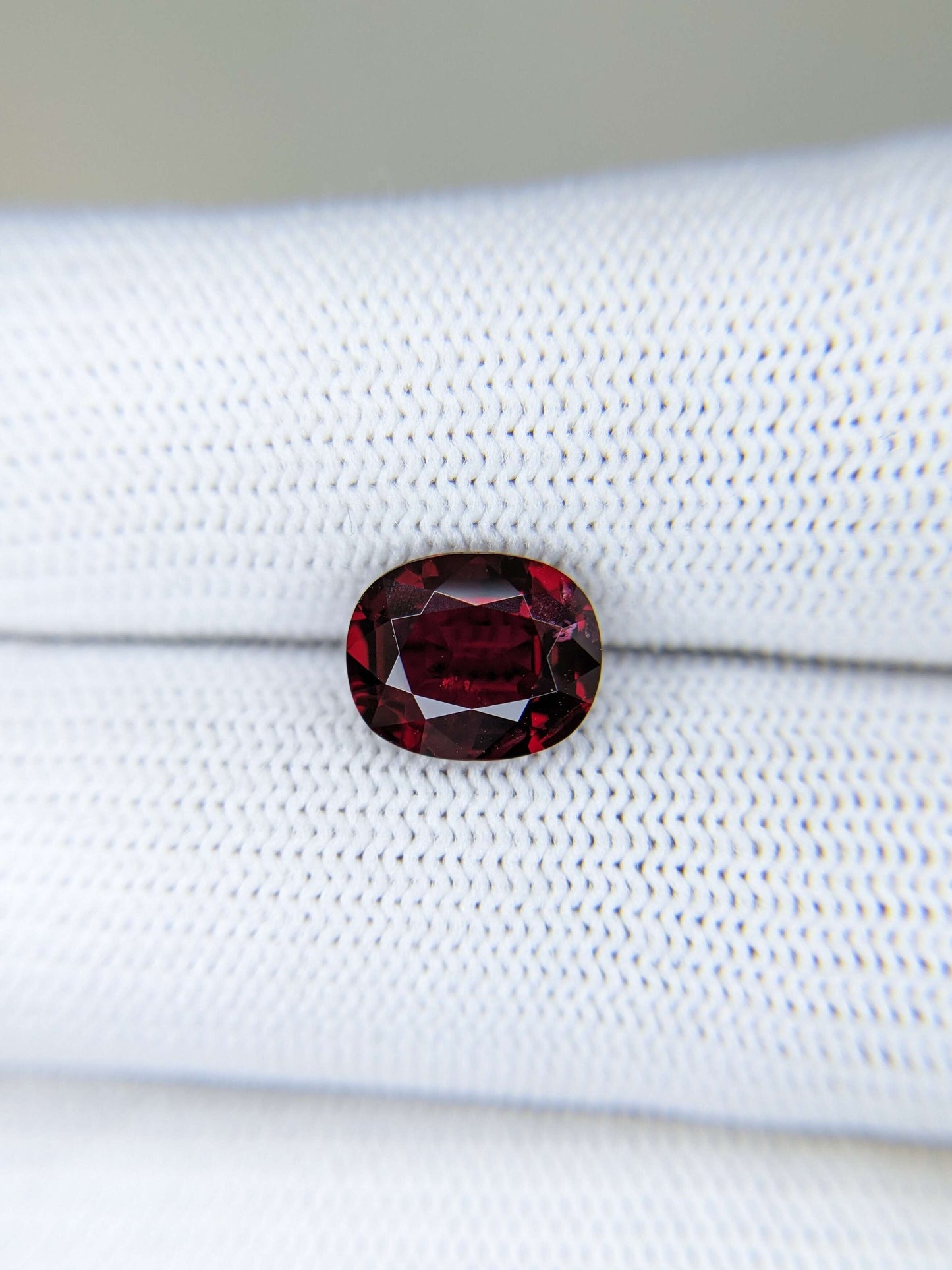 Red gemstone on a white background