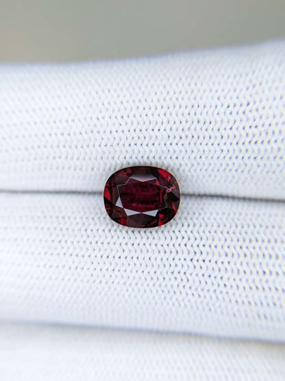Red gemstone on a white background