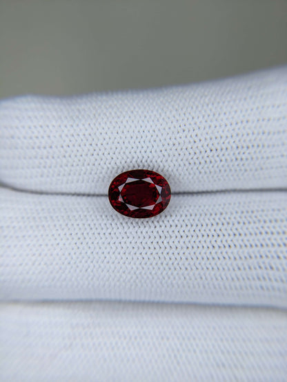 Red gemstone on a white cloth background