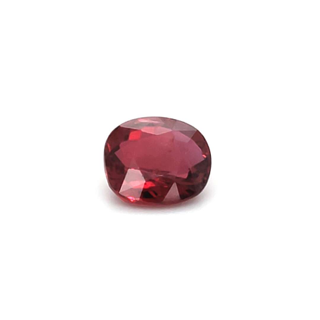 Red gemstone on a white background