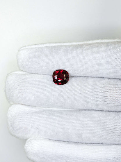 cushion red ruby loose gemstone on a white background
