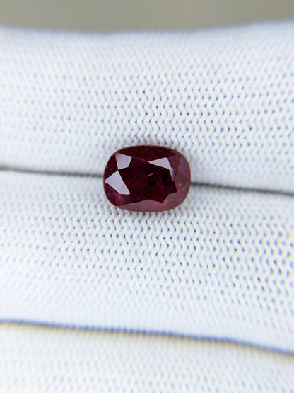 3.56 Carats Oval Cut Heat Red Ruby Loose Gemstone On Hand Closeup