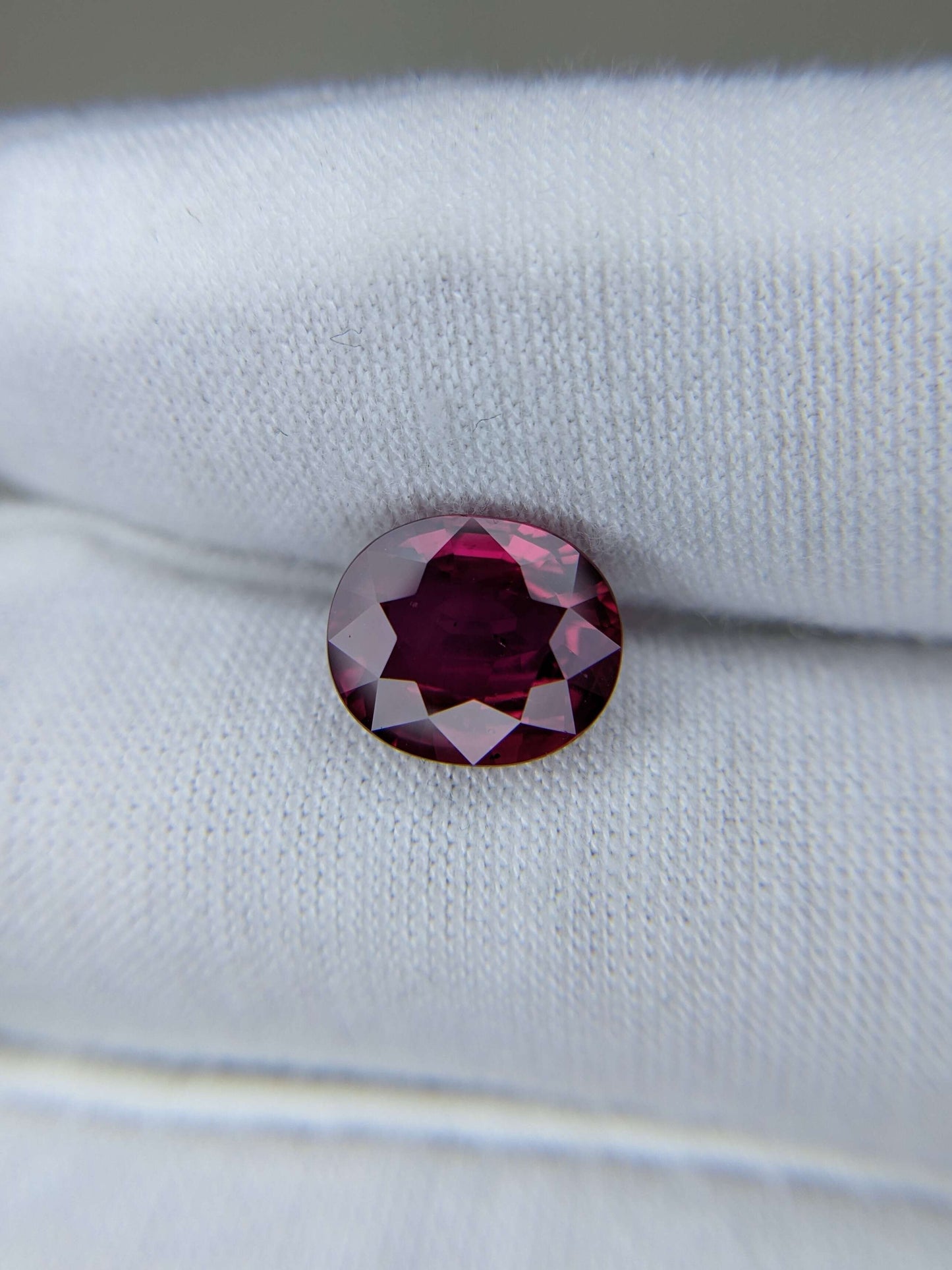 Red Ruby no heat gemstone on a white background