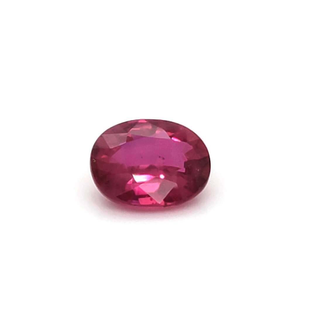 Red Ruby no heat gemstone on a white background