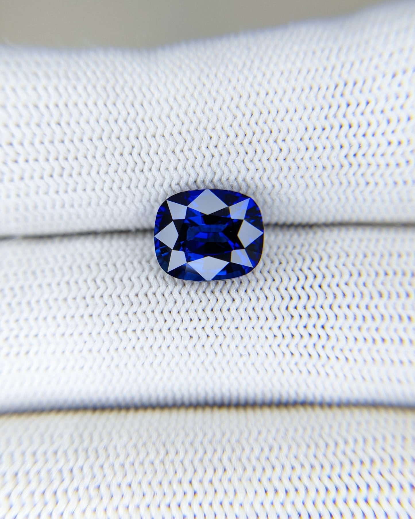 4.03 Carat Cushion Cut Heat Blue Sapphire Loose Gemstone on hand closeup